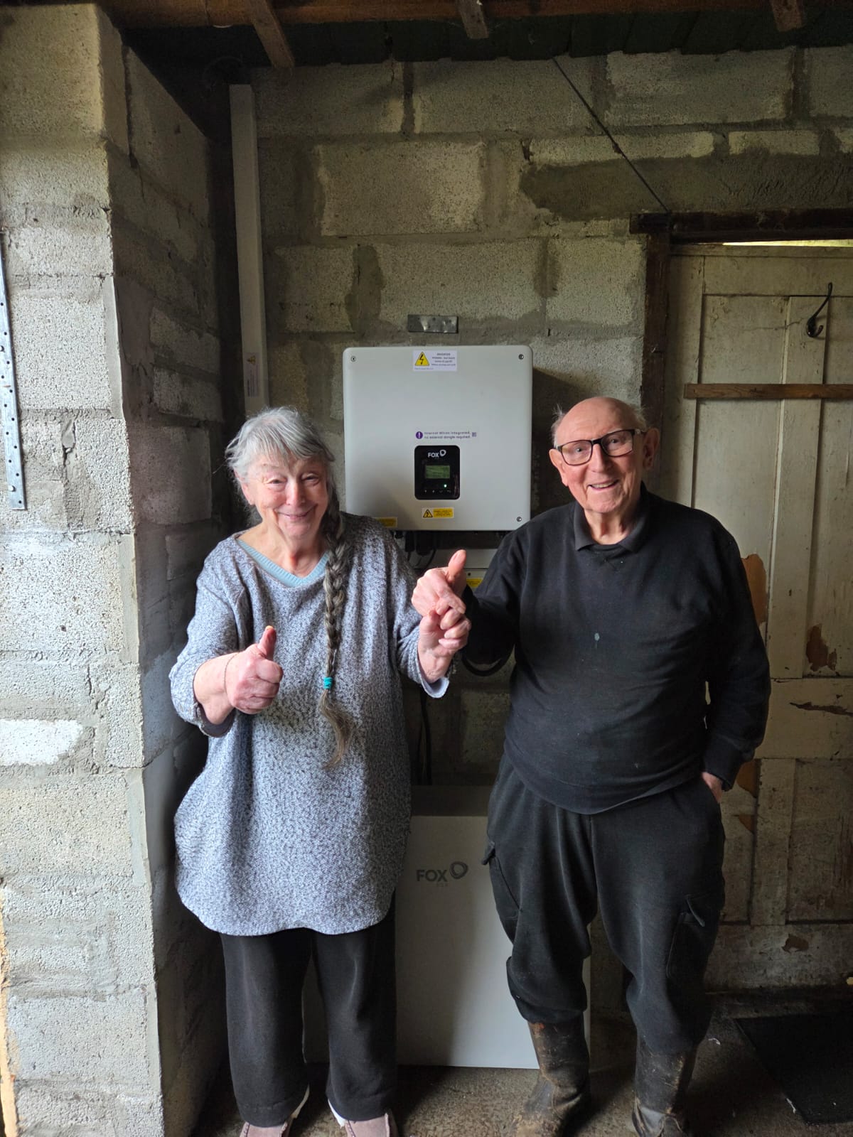 Happy customers with their new FoxESS battery storage system installed by CCS Heating